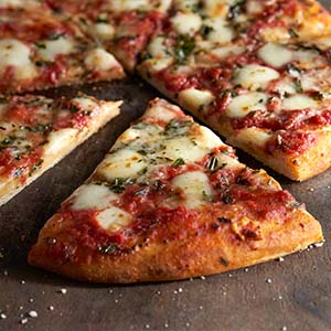 Amy's Margherita pizza slices on a wooden table